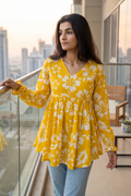 Trendy yellow floral printed peplum top with full sleeves