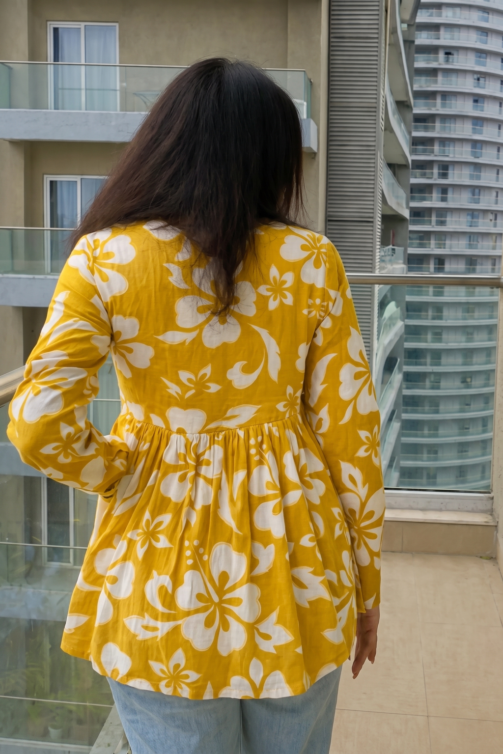 Trendy yellow floral printed peplum top with full sleeves