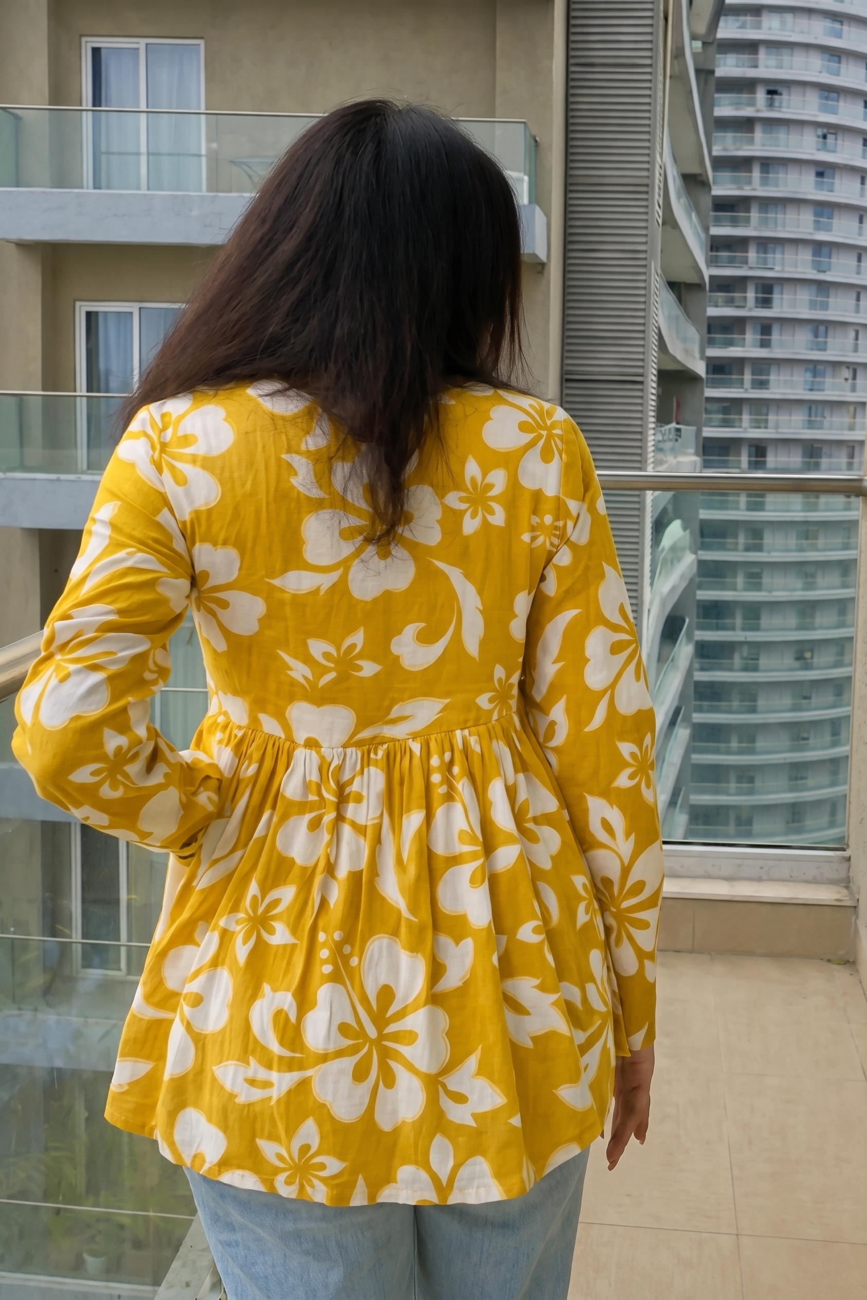 Trendy yellow floral printed peplum top with full sleeves