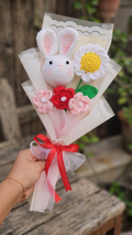 crochet bunny with daisy bouquet