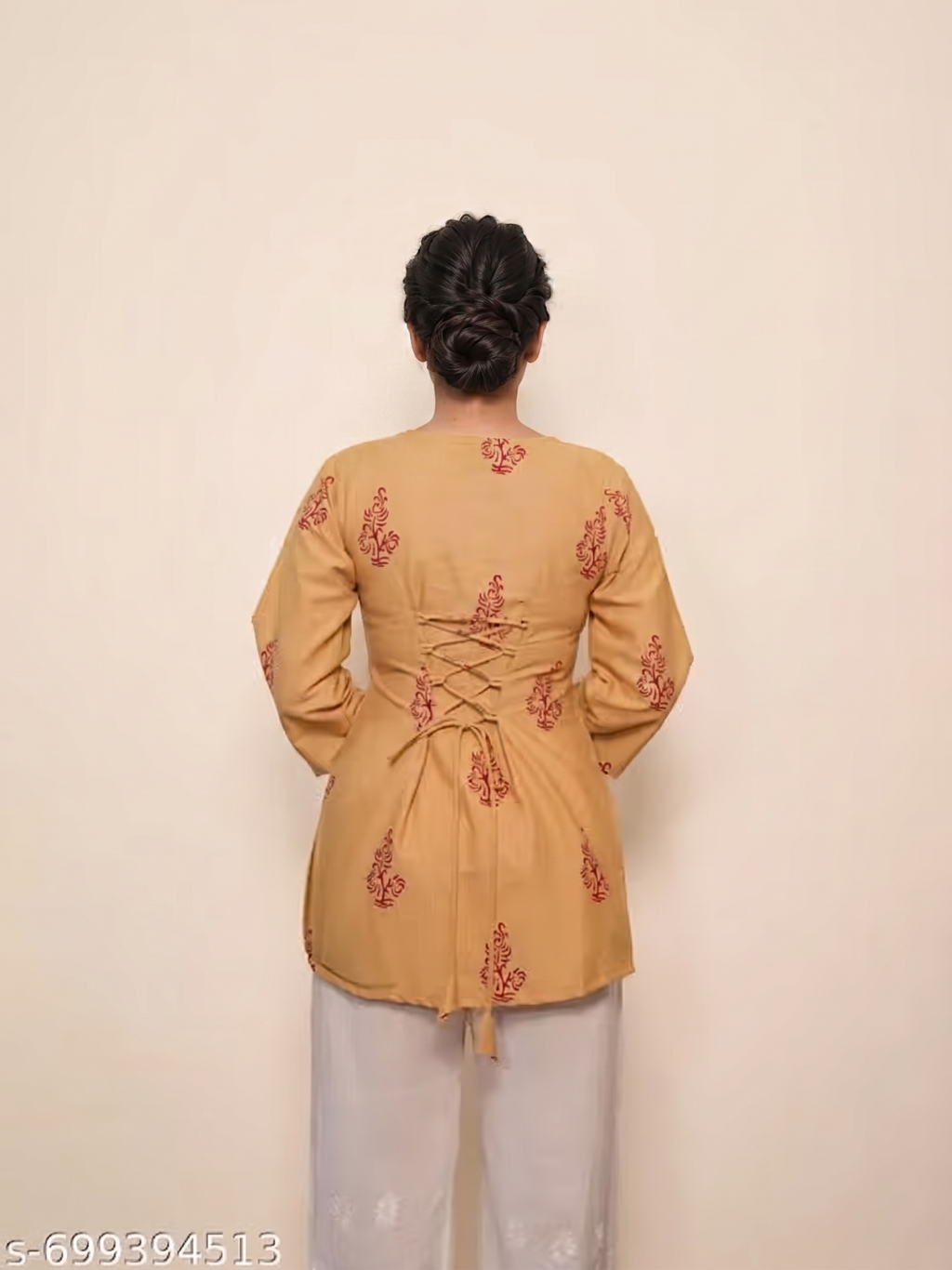 square neckline, front tie-up tassels, and floral block prints.