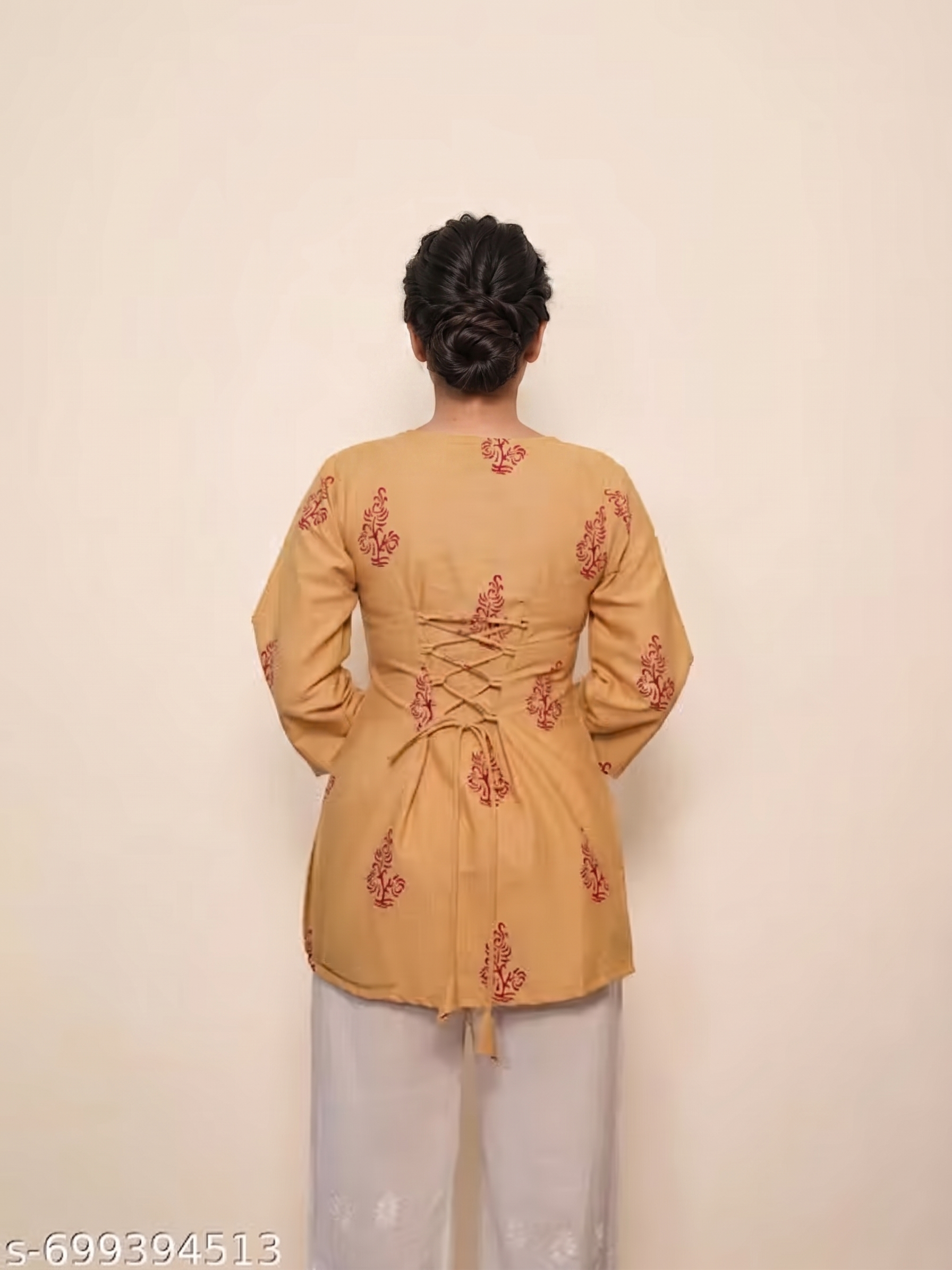square neckline, front tie-up tassels, and floral block prints.